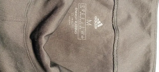 Pantalones Adidas negros con rayas rosas