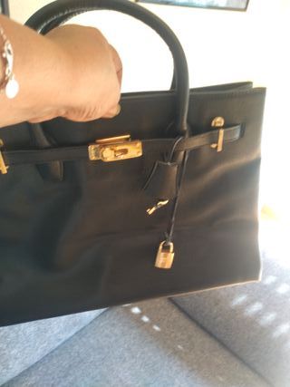 Borsa Hermès nera e dorata