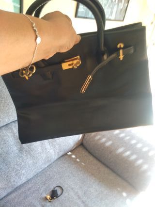 Borsa Hermès nera e dorata