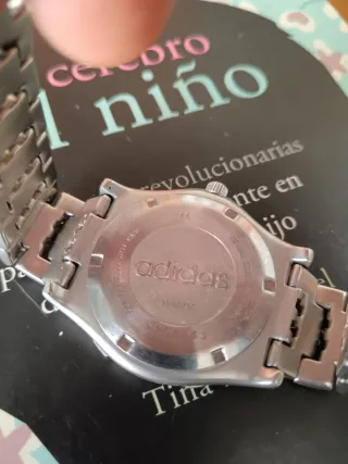 Reloj Adidas Naranja y Plateado 40mm con corona. 