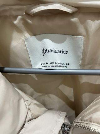 Plumas Stradivarius beige