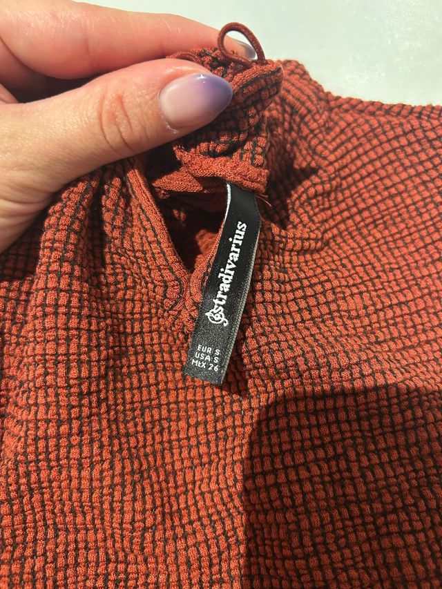 Crop Top sin mangas cuello alto