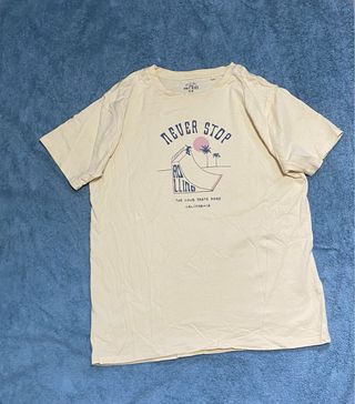 Camiseta amarilla Never Stop Rolling