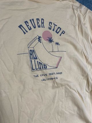 Camiseta amarilla Never Stop Rolling
