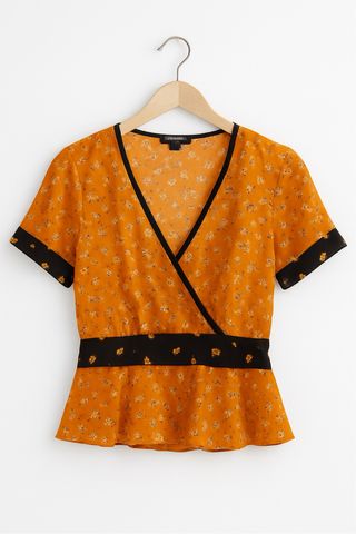 Blusa mostaza con estampado floral