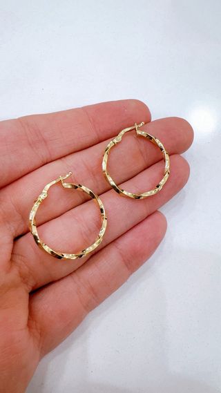 Orecchini cerchio intrecciati in oro 18kt 750