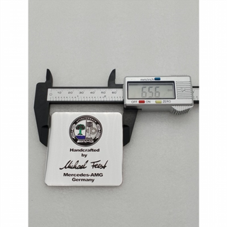 EMBLEMA MERCEDES AMG MICHAEL FEEST plata logo en