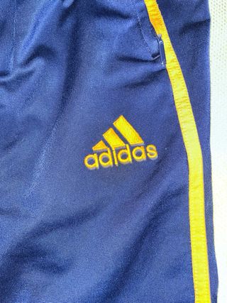 Pantalón Adidas azul y dorado