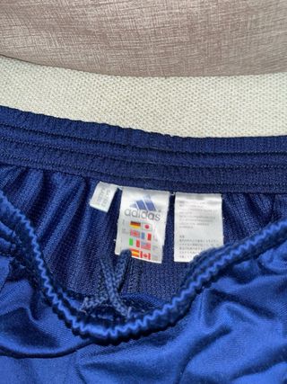 Pantalón Adidas azul y dorado