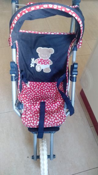 Carrito de juguete con osito y flores