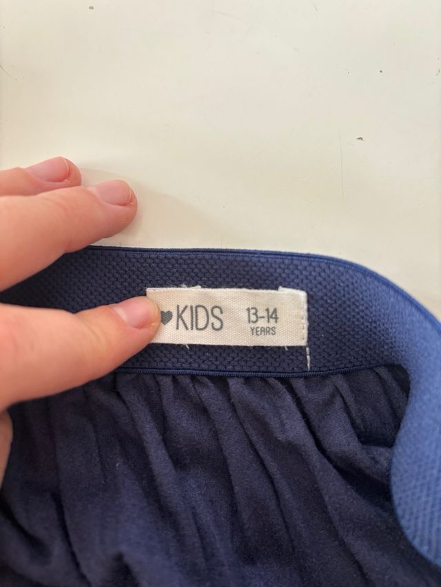 Falda plisada azul con brillo