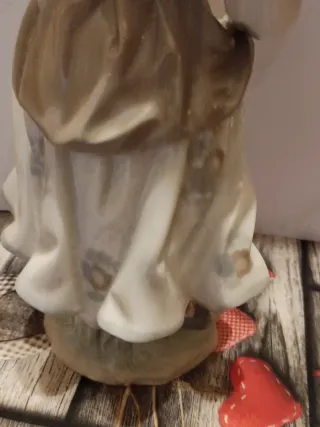 Figura Lladro porcelana niña con pájaro
