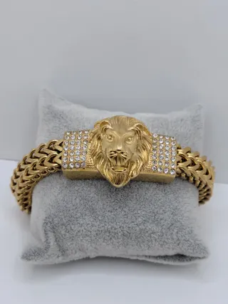 Pulsera dorada con cabeza de león y circonitas 