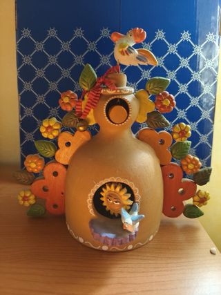 Fischietto in terracotta a forma di pavone