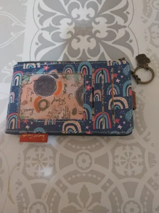 Monedero con diseño de castillo y globo