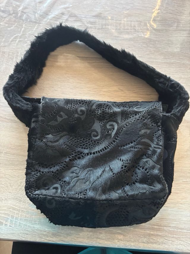 Bolso de mano de piel de la marca Acosta.