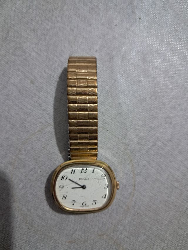 Reloj Dulux Dorado y Blanco