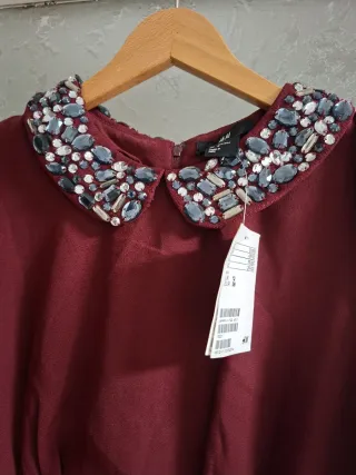 Vestido nuevo con cuello joya