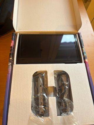 Nintendo Switch OLED bianco e nero + accessori