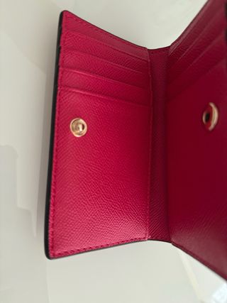 Cartera Tous rosa (fucsia) con llavero.