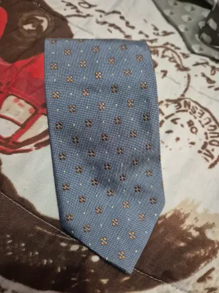 Corbata azul con estampado floral marrón