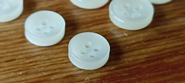 Juego de 15 botones blancos