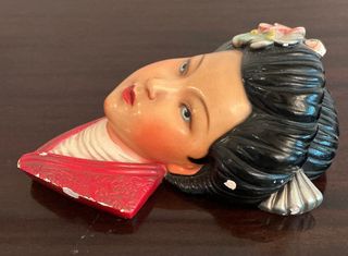 Scultura testa donna giapponese