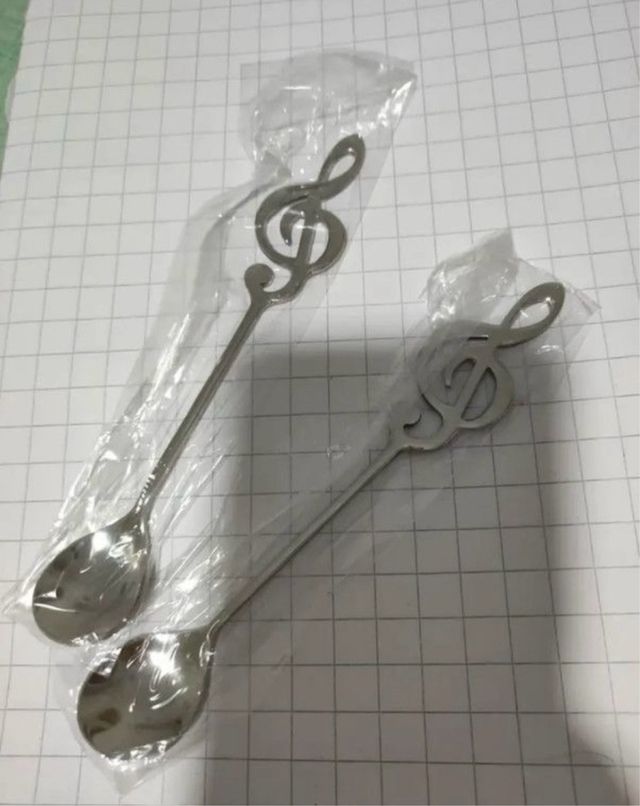 Cuchara clave de sol plateada