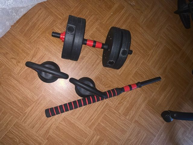 Conjunto de pesas y barra de ejercicio