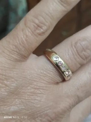 Anillo acero dorado circonitas rosas