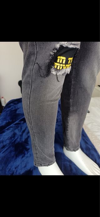 Vaqueros Philipp Plein grises con calavera amarill