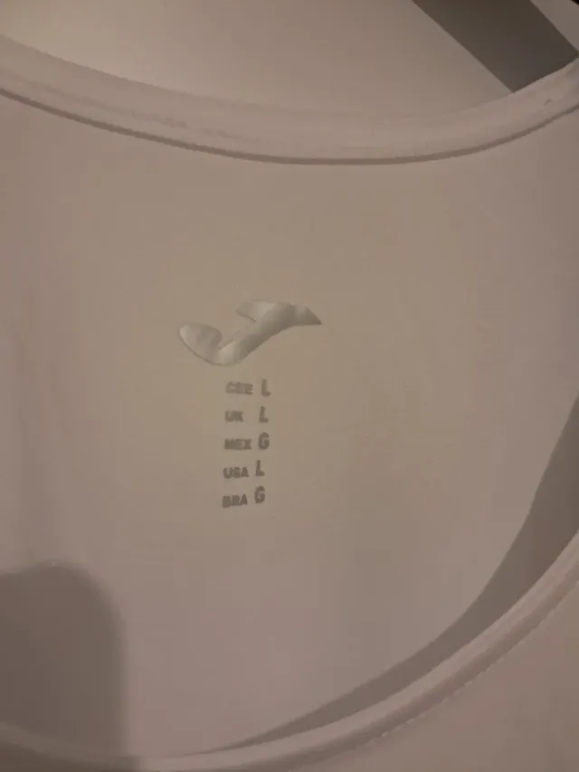 Camiseta Joma sin mangas blanca y azul