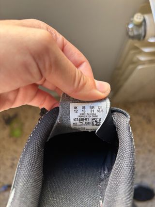 Botas de fútbol Puma niño negras/plateadas