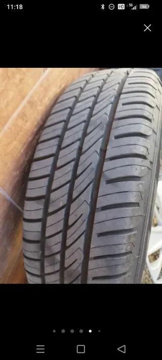 Llantas 4x100 con neumáticos y tapacubos