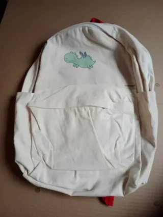 Mochila infantil beige con dino