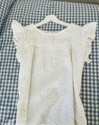Blusa blanca topos dorados