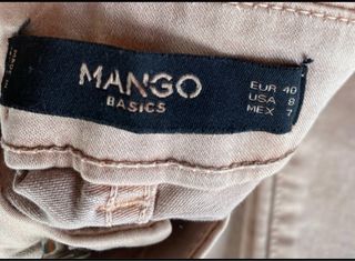Pantalones rosas con cremallera marca Mango