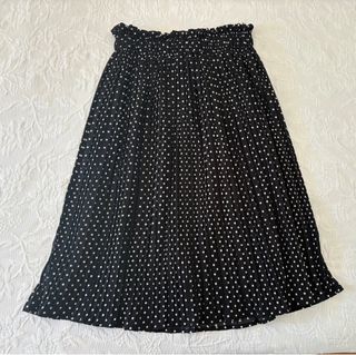 Falda plisada negra lunares blancos, talla 38