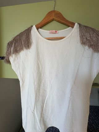 Maglia bianca con frange dorate