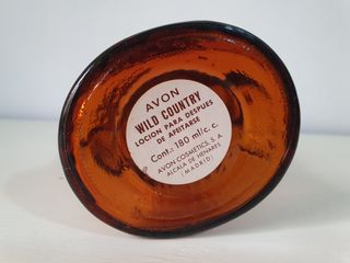 Bottiglie di profumo Avon Dog and Bear degli anni '90