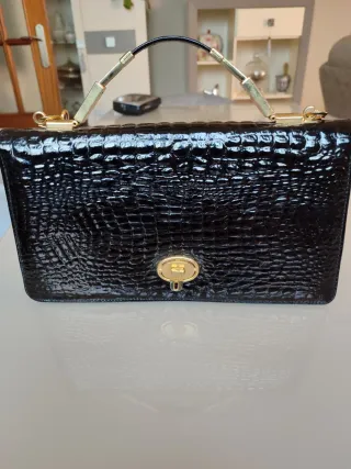 Bolso piel negro cocodrilo dorado