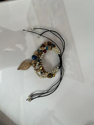 Pulsera triple dorada y tonos marrones