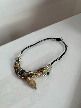 Pulsera triple dorada y tonos marrones