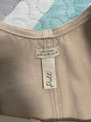 Peto corto beige con bolsillos Talla M