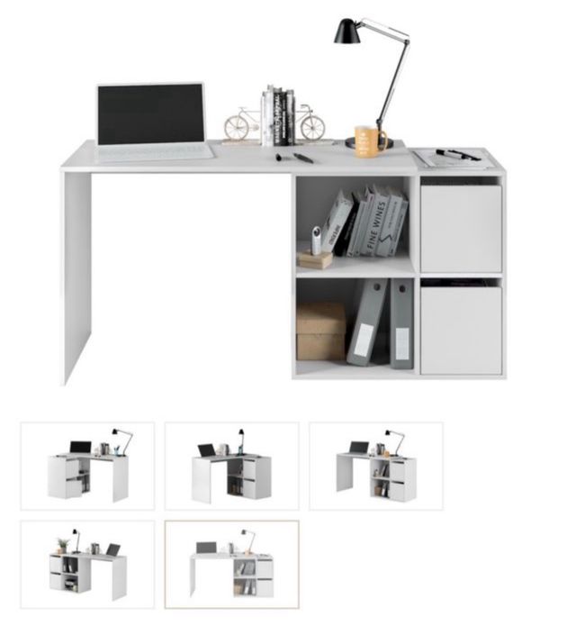 Escritorio blanco de madera con cubículos.