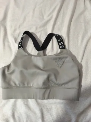 Sujetador deportivo Guess gris.Xs