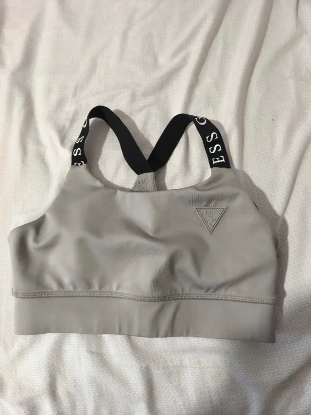 Sujetador deportivo Guess gris.Xs