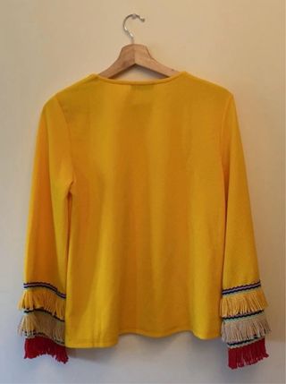 Jersey amarillo con flecos
