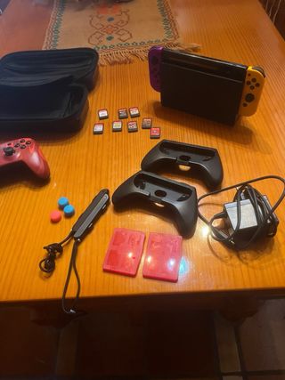 Nintendo Switch Morado/Rojo + Accesorios
