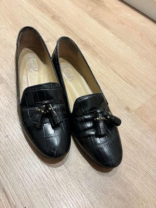 Zapatos planos  negros con flecos
